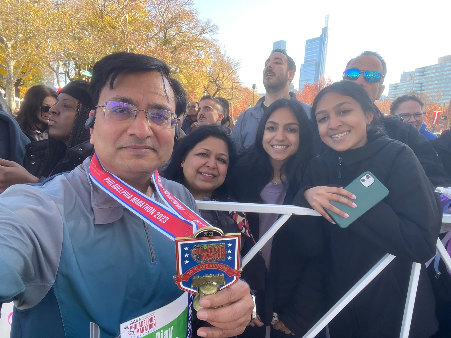 Ajay celebrating the 2023 Philadelphia Marathon with his family
