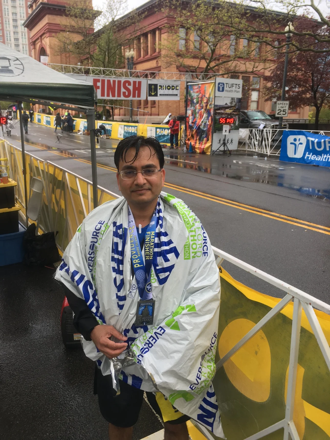Ajay after finishing the Providence Marathon in the rain in 2019